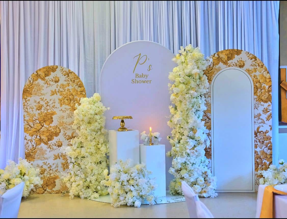 Sophisticated baby shower table arrangement with upscale floral decor