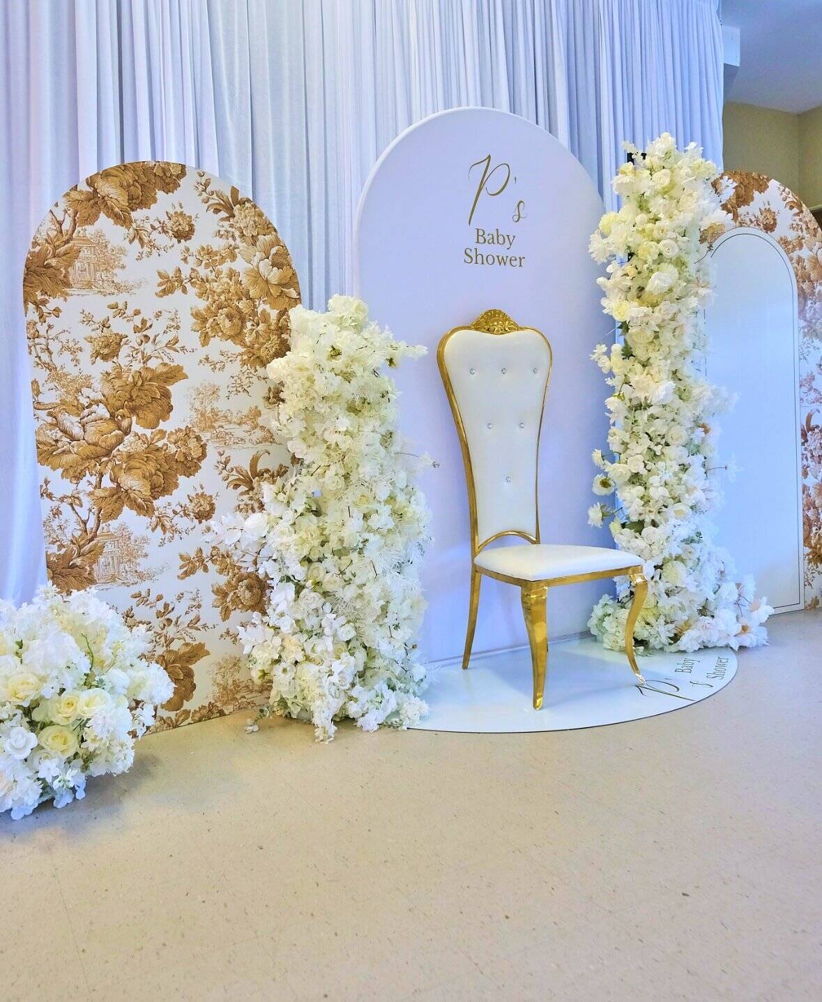 Classic baby shower centerpiece with soft florals and candle decor