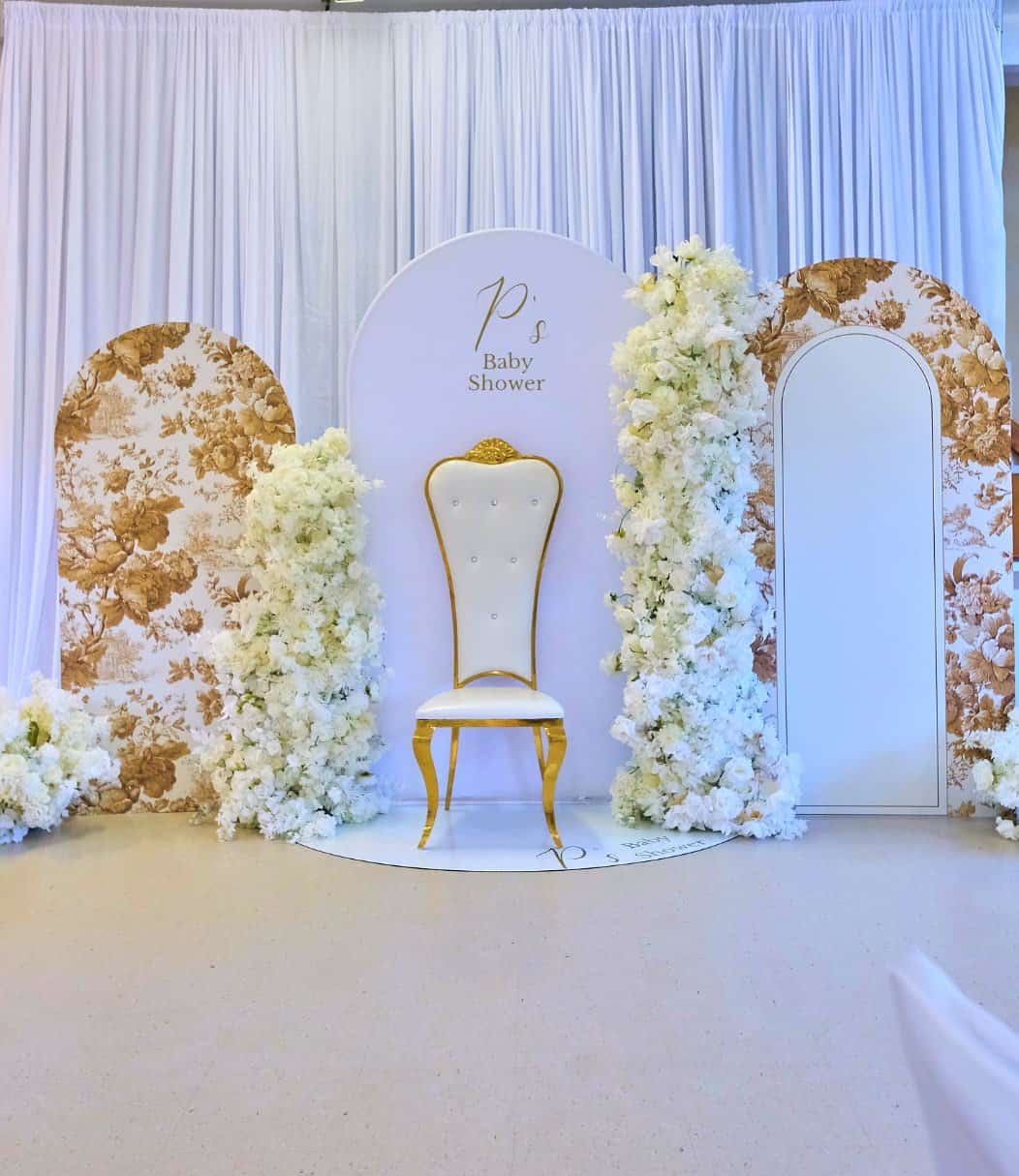 Luxury baby shower decor with textured linens and premium floral elements