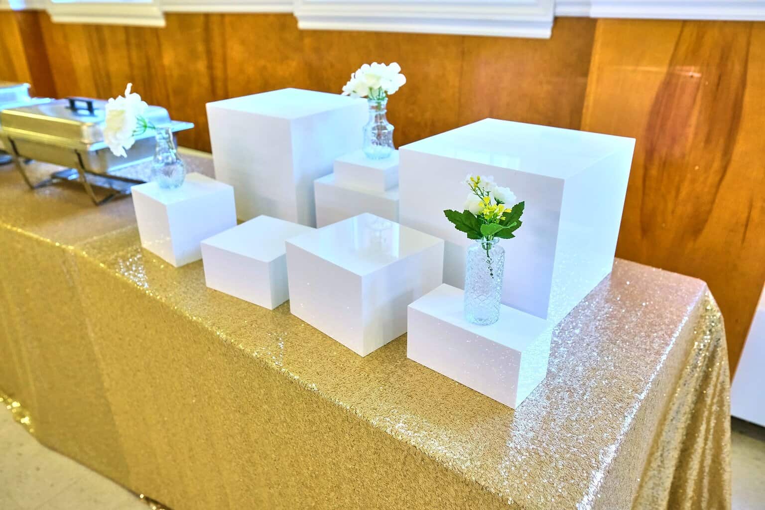 Sophisticated baby shower table styling with greenery and refined decor