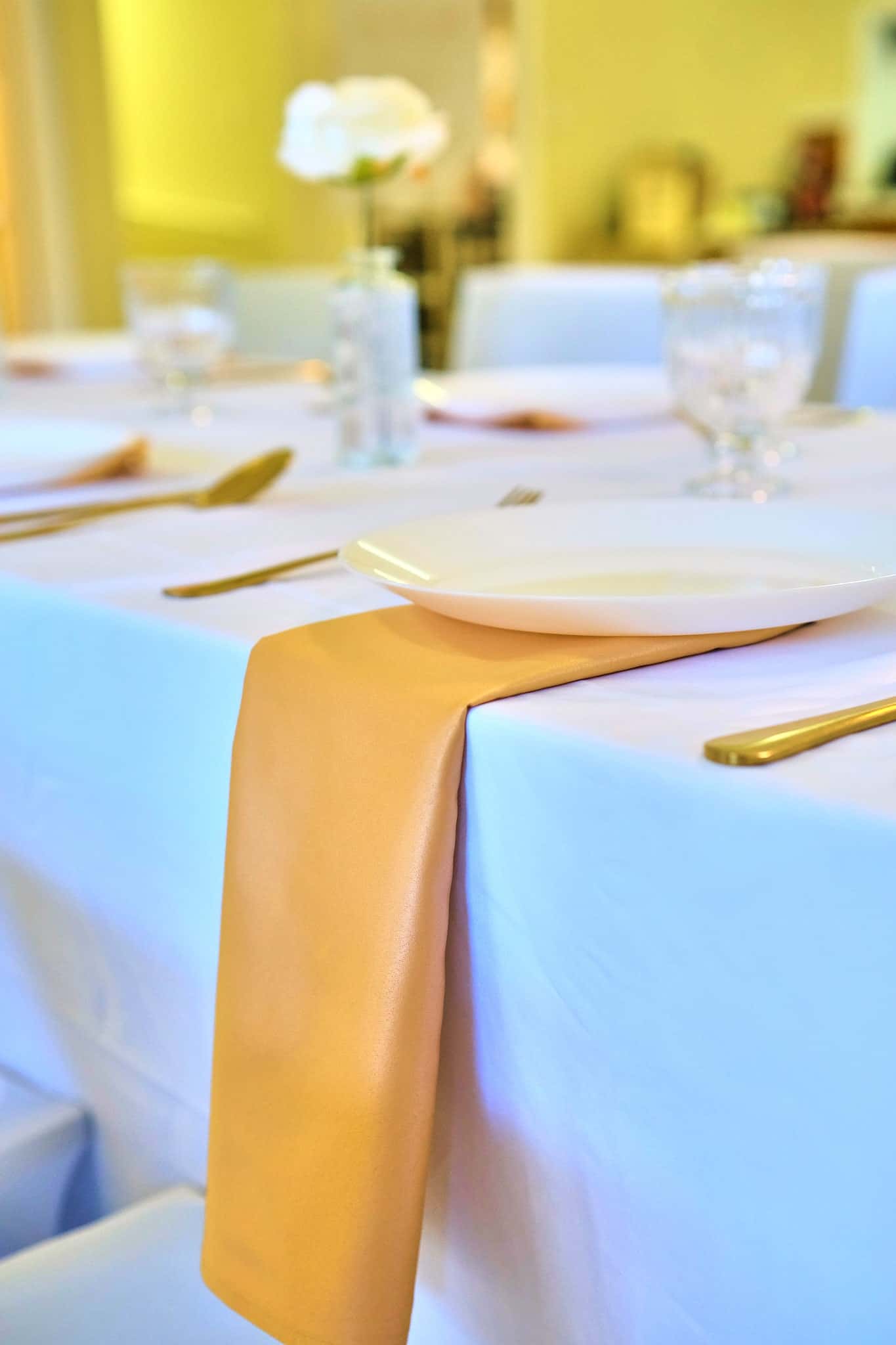 Elegant baby shower table setting with greenery and soft decor