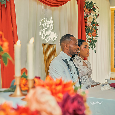 Event table with white tablecloth and place settings