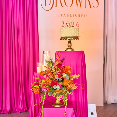 Designer feature – cake wall, florals and fuchsia draping Gallery – tablescape with bold compote arrangement